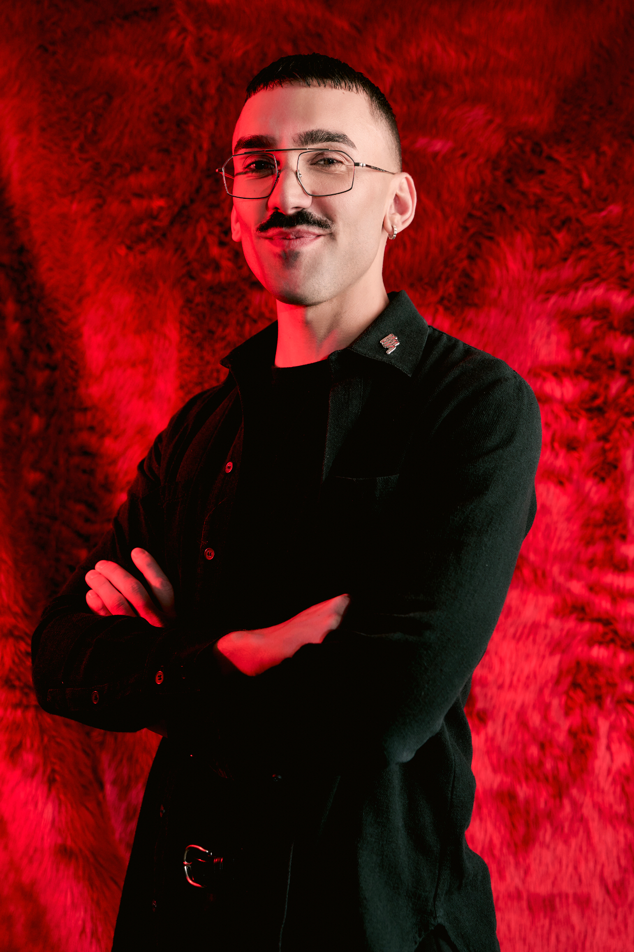 Marcus Willis, Founder of Kill Boring Dead, against a red faux-fur backdrop.
